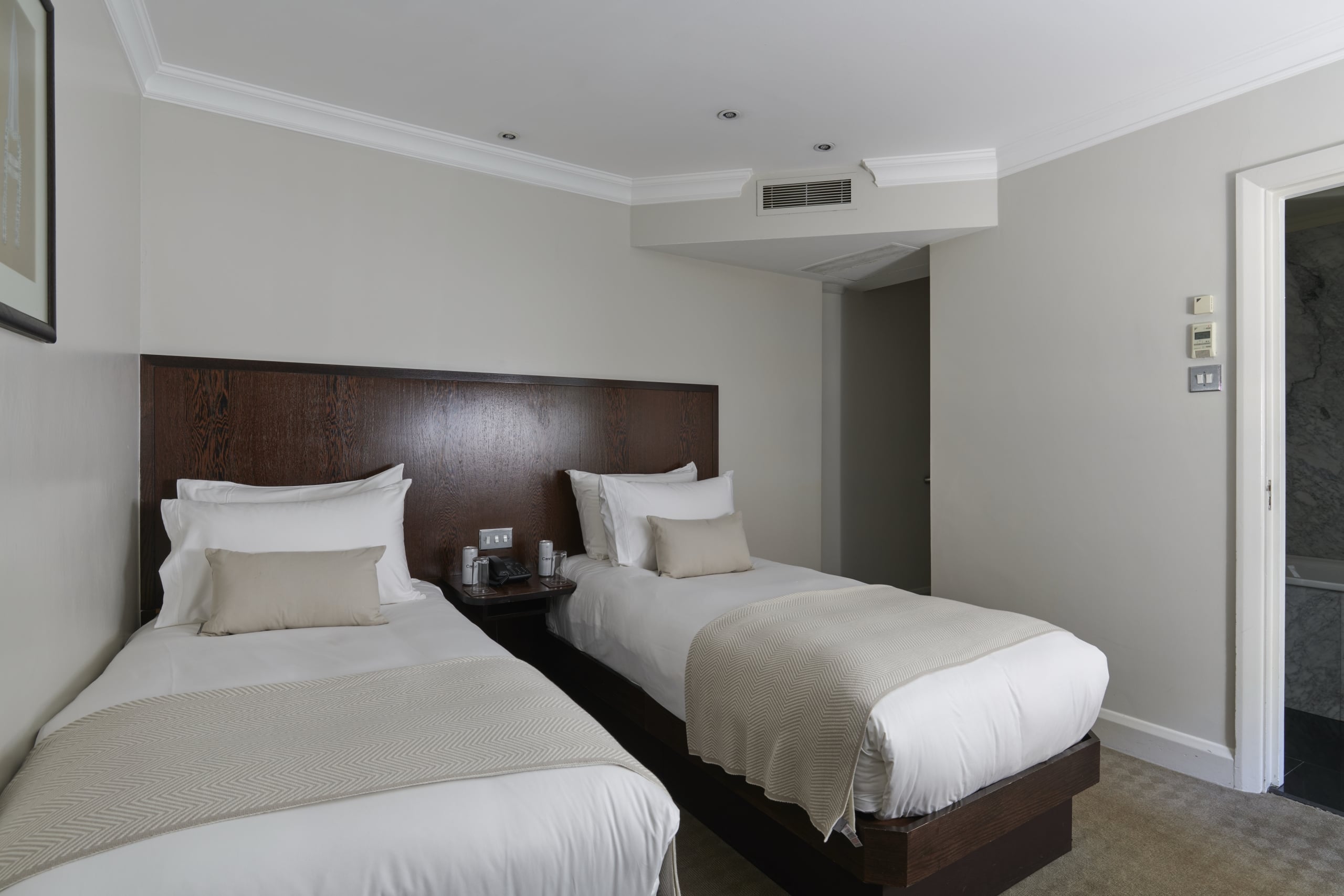 Standard twin room beds with fresh white linens